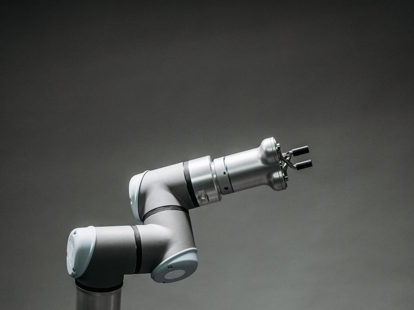 Six-axis collaborative robot arm with a gripper in the working position